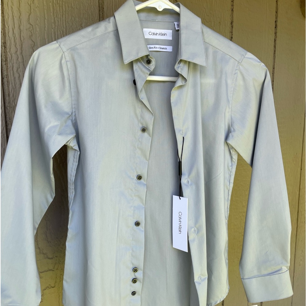Boys dress shirt. Brand new with tags. Perfect condition. Calvin Klein boys 10.